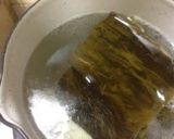 A picture of step 3 of Golden Dashi Stock with Konbu and Bonito Flakes.