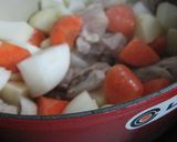 A picture of step 8 of Easy Rich Cream Stew in a Le Creuset Pot.