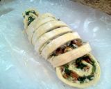 A picture of step 11 of Bacon Spinach Swirls.