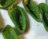 A picture of step 2 of Jalapeños stuffed with tuna.