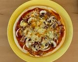 A picture of step 5 of Pizza with lots of mushrooms!.