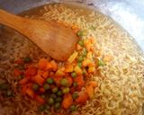 A picture of step 7 of Jollof Vegetable noodles with fried eggs.