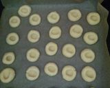 A picture of step 5 of Jam Thumbprint cookies.