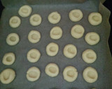 A picture of step 5 of Jam Thumbprint cookies.