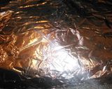 A picture of step 16 of Foil wrapped honey mustard pork loin with zucchini, squash, and baby carrots.