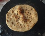 A picture of step 4 of Whole wheat (laal atta) sesame seeds naan on tawa.