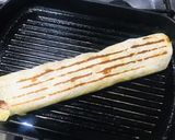 A picture of step 3 of Mango 🥭 sausages wrap.