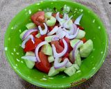 A picture of step 2 of Tomato, Cucumber, Fig, and Melekouni Salad.