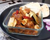 A picture of step 6 of Khada Masala Gosht with chapati.