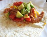 A picture of step 10 of Sausage and avocado salad tortillas.