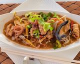 A picture of step 2 of Thin Noodles With Seafood Tom Yum.
