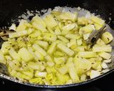 A picture of step 3 of Soya granules with potato and fresh green peas.