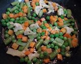 A picture of step 1 of Dj's Veggies Tomato Soupy Noodles.