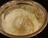 A picture of step 7 of Vanilla Christmas Layer Cake with Creamy Vanilla Buttercream Frosting.