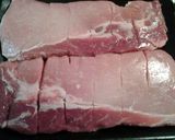 A picture of step 2 of deep fried pork loin.