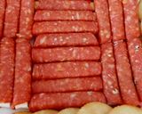 A picture of step 5 of My cheese wrapped in Pepperoni and Savoury Crackers 🤩.