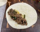 A picture of step 6 of Beefy Poblano Enchiladas.