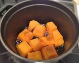 A picture of step 6 of Simmered Kabocha Squash in a Staub Cocotte.