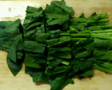 A picture of step 1 of Butter-Sautéed Spinach with Caramelized Soy Sauce.