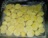 Foto del paso 2 de la receta: Horneado de jamoncitos de pollo con patatas a la naranja