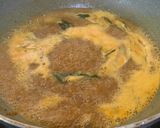 A picture of step 3 of Tamarind side dish parupu urandai puli kozumbu.
