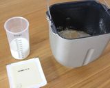 A picture of step 1 of Butter-free Tofu Bread in a Bread Maker.