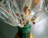 A picture of step 6 of Make Your Own Red Chili and Garlic Oil.