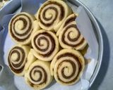 A picture of step 13 of Professional cinnamon rolls topped with cream cheese icing.