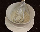 A picture of step 7 of White Chocolate Truffle Cupcakes with Whipped White Chocolate Mascarpone Frosting.