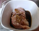 A picture of step 1 of Easy in the Microwave! Sake Steamed Chicken with Umeboshi and Shiso Leaves.