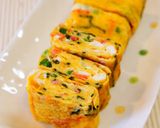 A picture of step 4 of Green Onion, Nori Seaweed and Sakura Shrimp Tamagoyaki.