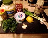 A picture of step 1 of Herbed green goddess dressing over lettuce wedges.