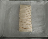 Foto del paso 5 de la receta: Trenza de hojaldre rellena de verduras, bacon y queso