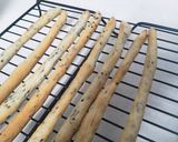 A picture of step 11 of Foolproof Sesame Seed and Cheese Grissini.