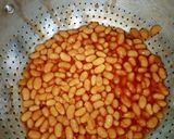 A picture of step 5 of Toasted Bread, Egg with Sardine Sauce, Baked Beans with Sausage.