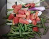 A picture of step 1 of Manchow Soup / Veg soup topped with Crispy fried noodles.