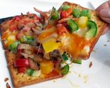 A picture of step 5 of Ham And Pepper Cracker Pizza.