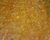 A picture of step 6 of Dam allu with colourful zeera rice.