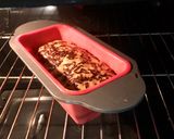 A picture of step 1 of Banana bread with shredded chocolate on top.