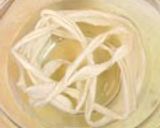A picture of step 3 of Burdock Roots Wrapped in Kombu.
