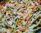 A picture of step 4 of Fried Green Beans with Ham & Radish Greens.