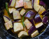 A picture of step 2 of Begun Jhaal Posto / Eggplant with Poppy seed paste for lunch in Thakurbari style.