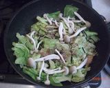 A picture of step 5 of Pn-Fried and Steamed Salmon and Cabbage.