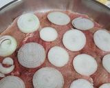 A picture of step 2 of Meat with potatoes in the oven.