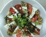 A picture of step 2 of Haloumie cheese with tomato.
