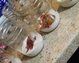 A picture of step 1 of Blueberry, Pomegranate, Peanut Butter & Plum Jam Overnight Oats.