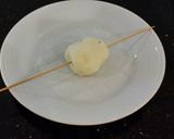 A picture of step 2 of Tornado Potatoes.