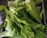 A picture of step 1 of Green Mustard and Salted Egg Soup.