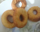 A picture of step 4 of Chocolate Donuts filled with custard.