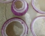 A picture of step 2 of Crispy Baked Onion Rings.